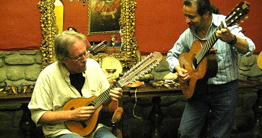 David attempts the charango in Cusco, Peru